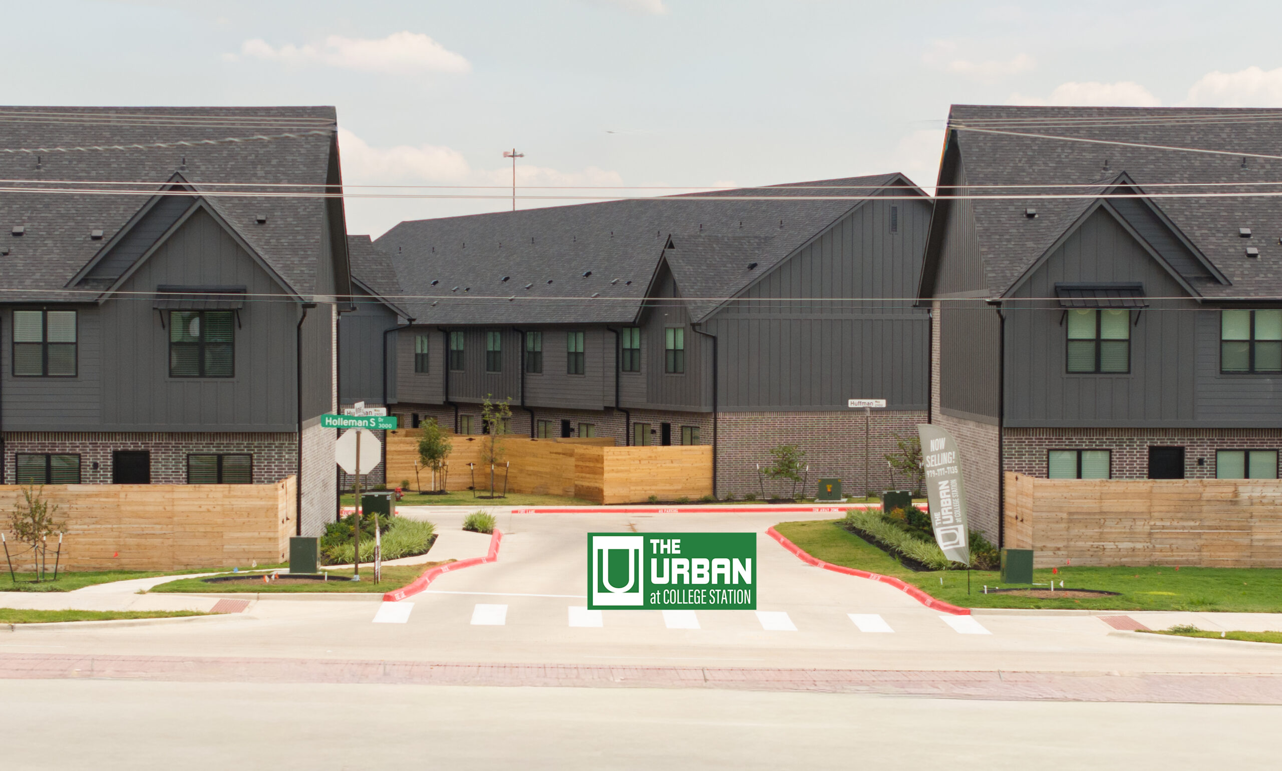 Street view of The Urban's modern townhome exteriors